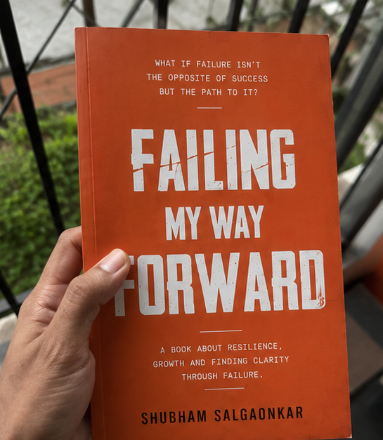 Failing My Way Forward paperback held in hand